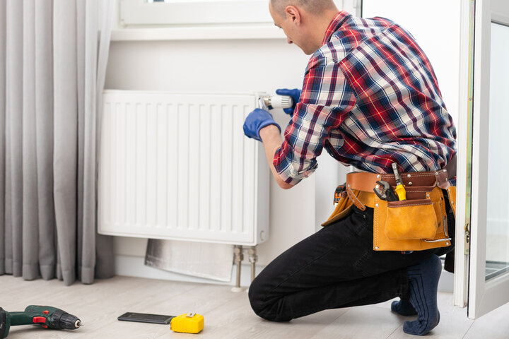 repairing radiator with wrench